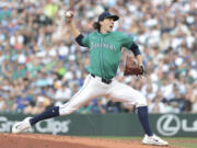 Seattle Mariners starting pitcher Logan Gilbert throws during the second inning of a baseball game against the New York Mets, Saturday, Aug. 10, 2024, in Seattle.