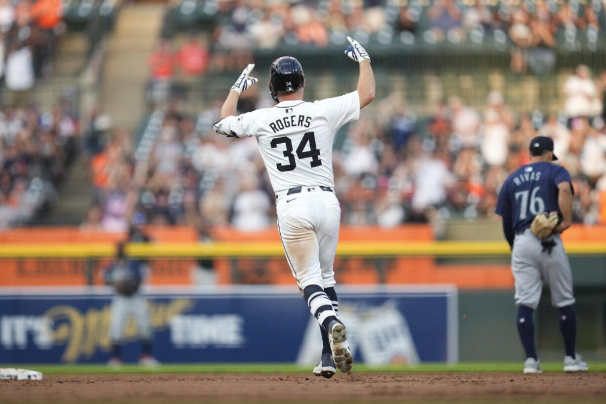 Detroit Tigers' Jake Rogers celebrates his grand slam against the Seattle Mariners in the fourth inning of a baseball game, Tuesday, Aug. 13, 2024, in Detroit.