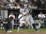 New York Yankees designated hitter Aaron Judge hits his 300th career home run, the fastest playing in MLB history to do so, during the eighth inning of a baseball game against the Chicago White Sox, Wednesday, Aug. 14, 2024, in Chicago.