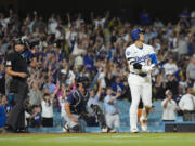 Los Angeles Dodgers designated hitter Shohei Ohtani (17) hits a grand slam during the ninth inning of a baseball game against the Tampa Bay Rays in Los Angeles, Friday, Aug. 23, 2024. The Dodgers won 7-3. Will Smith, Tommy Edman, and Max Muncy also scored.