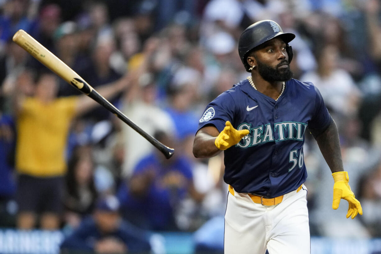 Seattle Mariners' Randy Arozarena flips his bat after hitting a three-run home run against the Tampa Bay Rays during the third inning of a baseball game Monday, Aug. 26, 2024, in Seattle.