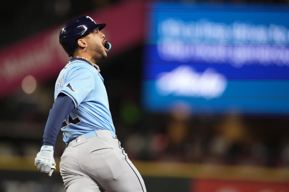 Tampa Bay Rays' Jose Siri reacts to hitting a two-run home run against the Seattle Mariners during the seventh inning of a baseball game, Tuesday, Aug. 27, 2024, in Seattle.