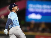 Tampa Bay Rays' Jose Siri reacts to hitting a two-run home run against the Seattle Mariners during the seventh inning of a baseball game, Tuesday, Aug. 27, 2024, in Seattle.