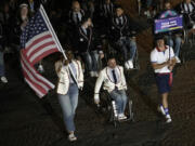 The U.S. delegation arrive for the Opening Ceremony of the 2024 Paralympics, Thursday, Aug. 29, 2024, in Paris, France.