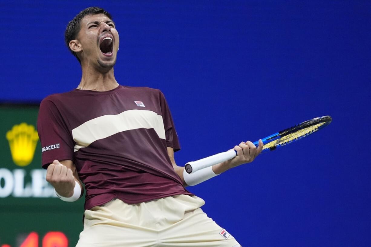 Alexei Popyrin, of Australia, reacts Novak Djokovic, of Serbia,during a third round match of the U.S. Open tennis championships, Friday, Aug. 30, 2024, in New York.