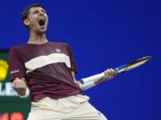 Alexei Popyrin, of Australia, reacts Novak Djokovic, of Serbia,during a third round match of the U.S. Open tennis championships, Friday, Aug. 30, 2024, in New York.