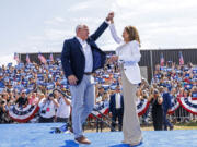 Democratic presidential nominee Vice President Kamala Harris is welcomed by running mate Democratic vice presidential nominee Minnesota Gov. Tim Walz before she delivers remarks at a campaign rally in Eau Claire, Wis., Wednesday, Aug. 7, 2024.