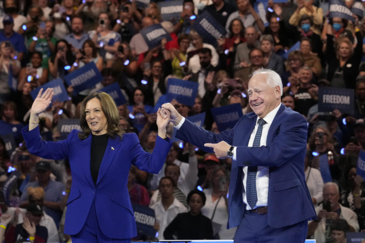 Democratic presidential nominee Vice President Kamala Harris and running mate Minnesota Gov. Tim Walz appear at the Fiserv Forum during a campaign rally in Milwaukee, Tuesday, Aug. 20, 2024.