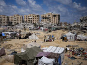 Palestinians displaced by the Israeli air and ground offensive on the Gaza Strip flee from Hamad City, following an evacuation order by the Israeli army to leave parts of the southern area of Khan Younis, Sunday, Aug. 11, 2024.