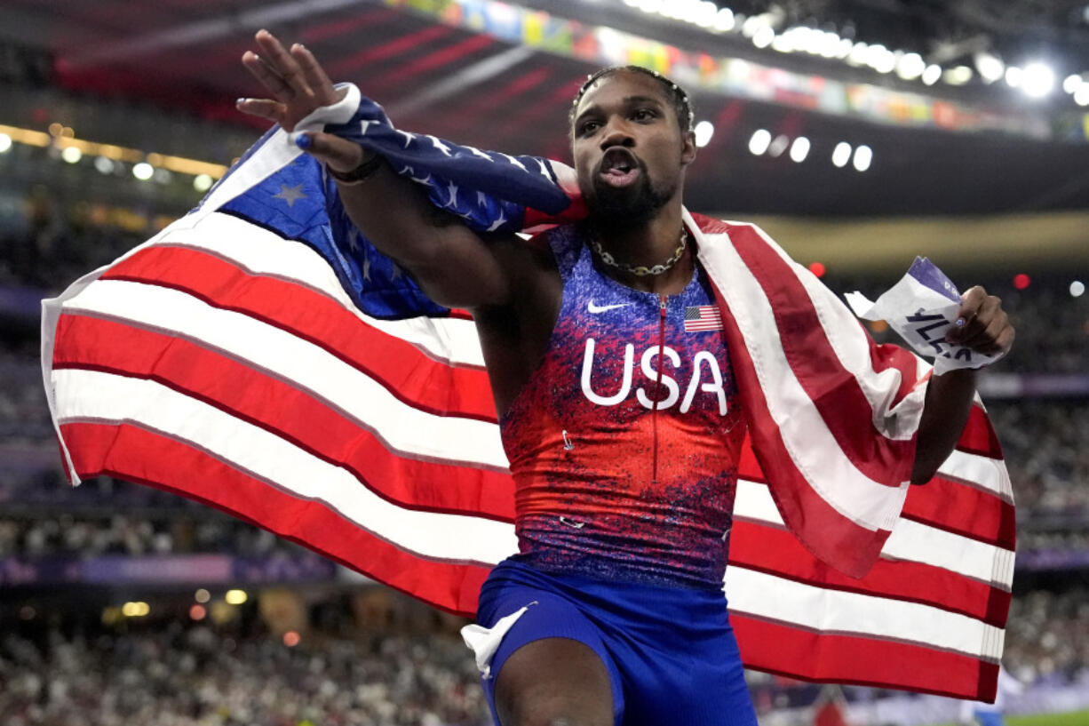 Noah Lyles, of the United States, celebrates after winning the men&rsquo;s 100-meters final at the 2024 Summer Olympics on Sunday.