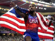 Noah Lyles, of the United States, celebrates after winning the men&rsquo;s 100-meters final at the 2024 Summer Olympics on Sunday.