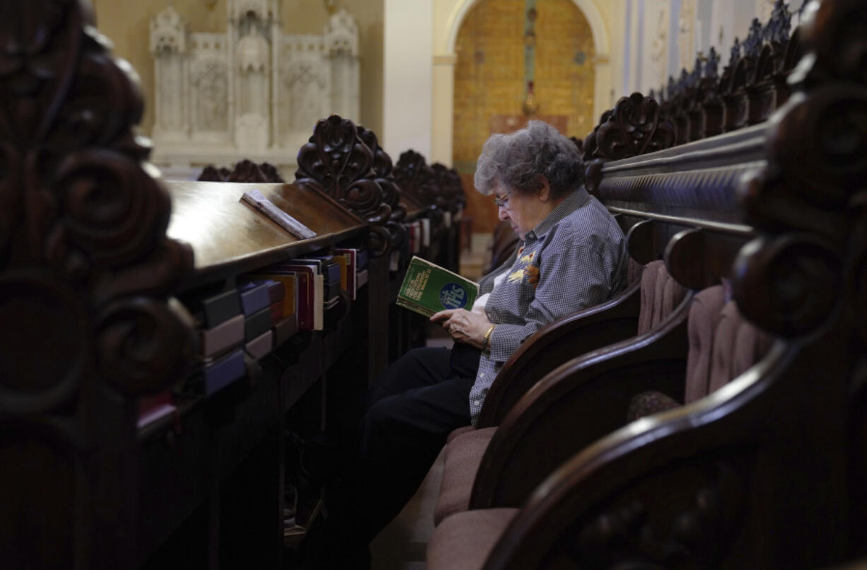 Sister Mary Margaret Kean reads a commentary on the Gospel after Wednesday morning prayer at the Mount St. Scholastica Benedictine monastery in Atchison, Kan., July 17, 2024.