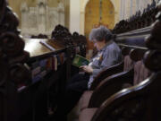 Sister Mary Margaret Kean reads a commentary on the Gospel after Wednesday morning prayer at the Mount St. Scholastica Benedictine monastery in Atchison, Kan., July 17, 2024.