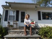 Mariah Smith, an Air Force veteran and board member of No One Left Behind, sits for a portrait on in front of her home in Stevens City, Va., Thursday, Aug. 1, 2024.