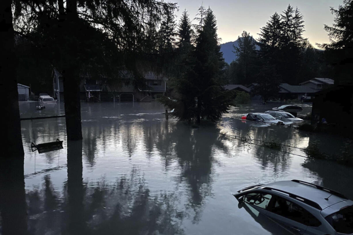 This image provided by the Alaska Department of Transportation and Public Facilities shows high water in a neighborhood in Juneau, Alaska, Monday, Aug. 6, 2024, following an outburst of flooding from a lake dammed by the Mendenhall Glacier.