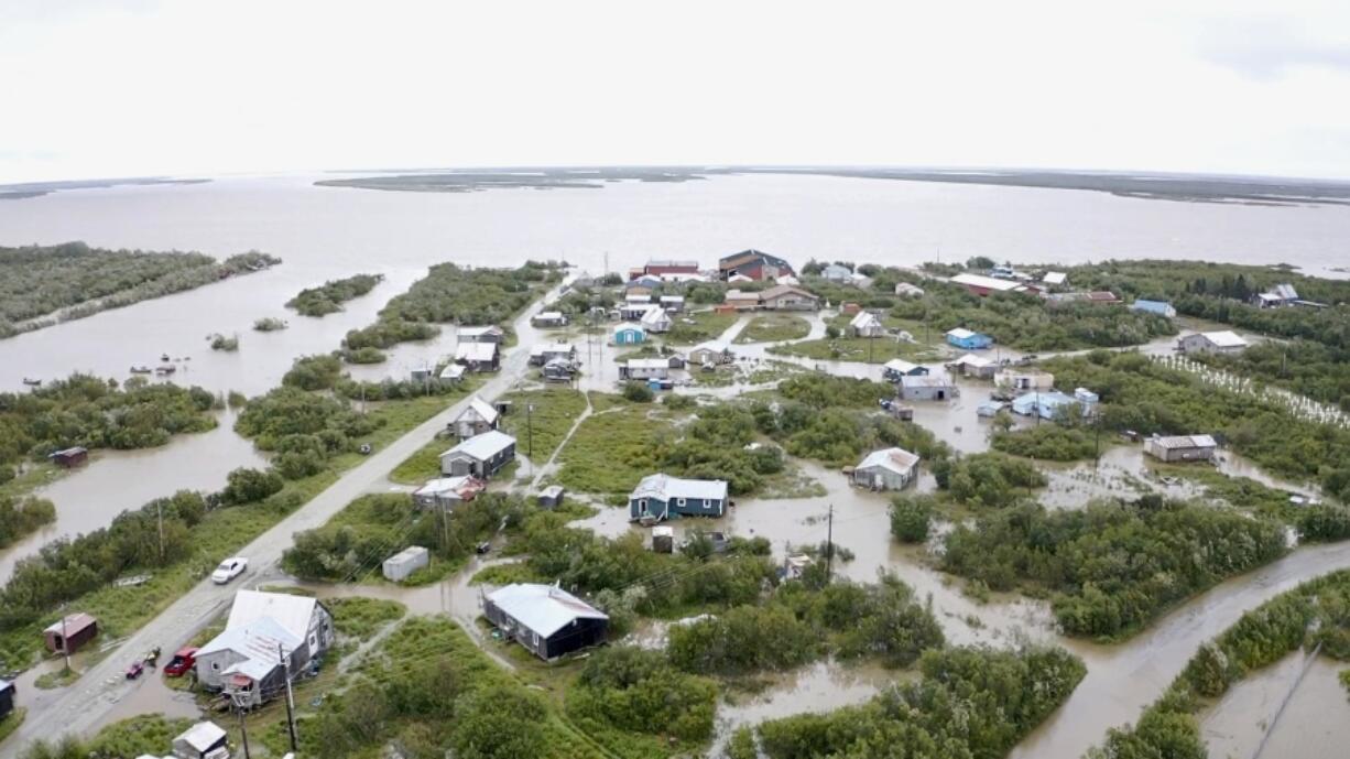 Water from an overflowing Kuskokwim River floods Napakiak, Alaska, Sunday, Aug. 18, 2024.