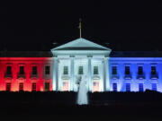 The White House is lit with the colors of the American flag to support team USA competing in the Paris Olympics, on Monday, July 29, 2024, in Washington. Former Presidents Barack Obama and George W. Bush will join an effort to commemorate America&rsquo;s 250th anniversary in 2026, highlighting the initiative&rsquo;s attempts to build bipartisan momentum in an era of extreme political polarization.  The former presidents and first ladies Michelle Obama and Laura Bush will serve as honorary national co-chairs of America250, the organization created by Congress in 2016 to oversee the celebration of the the 250th anniversary of the signing of the Declaration of Independence.