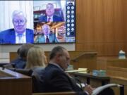 Mark Meadows, left, Stephen Binhak and Jim Eastman appear virtually during a pre-trial hearing in the fake electors case in Maricopa County Superior Court on Wednesday, Aug 28, 2024, in Phoenix.