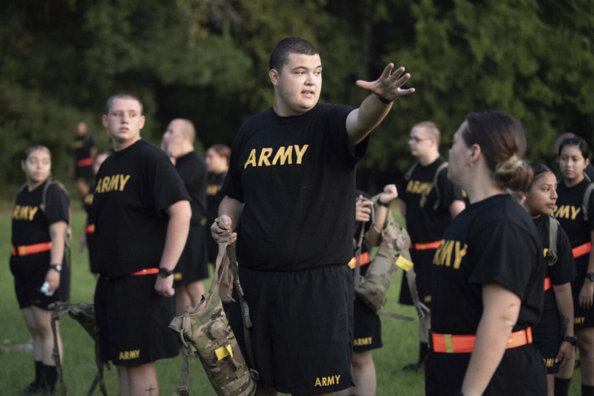 FILE - Students gather during physical training exercises in the new Army prep course at Fort Jackson in Columbia, S.C. Saturday, Aug. 27, 2022. The Army will expand its basic combat training for newly enlisted soldiers in what its leaders hope reflects a turning point as it prepares to meet the challenges of future wars. The added training will begin in October 2024 and comes as the Army works to reverse several years of dismal recruiting when it failed to meet its enlistment goals.