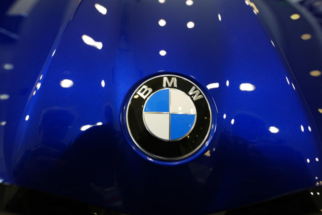 FILE - The company logo shines on the hood of an unsold vehicle at a Mini Honda BMW dealership on July 22, 2024, in Highlands Ranch, Colo.