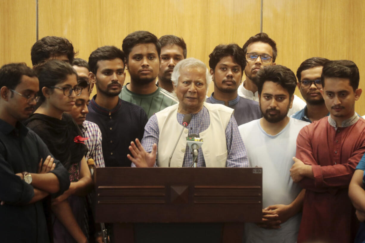 Nobel laureate Muhammad Yunus speaks to the media after his arrival at the airport in Dhaka, Bangladesh, Thursday, Aug. 8, 2024.