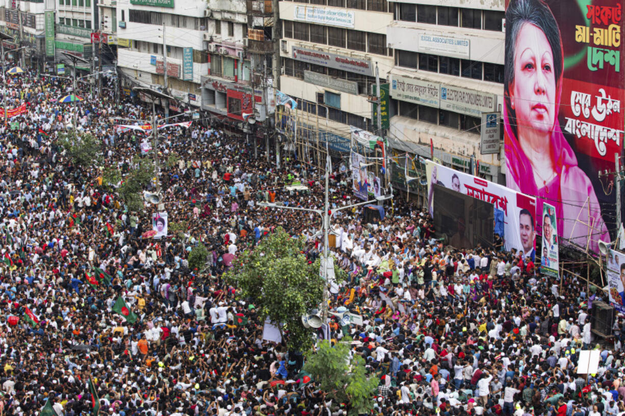 People gather in front of the Bangladesh Nationalist Party (BNP) headquarters during a protest rally in Dhaka, Bangladesh, Wednesday, Aug. 7, 2024.