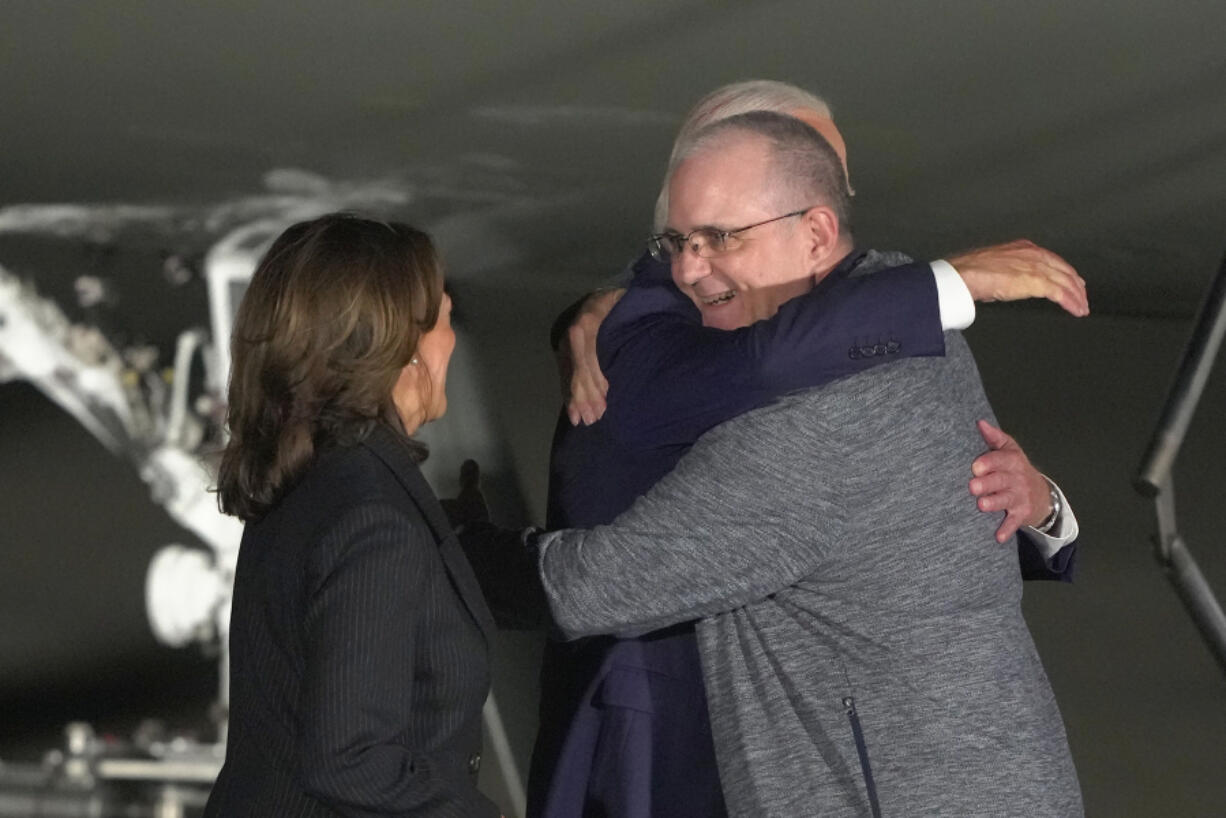 President Joe Biden and Vice President Kamala Harris greet Paul Whelan at Andrews Air Force Base, Md., following his release as part of a 24-person prisoner swap between Russia and the United States, Thursday, Aug. 1, 2024.