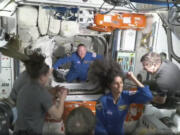 FILE - NASA astronauts Butch Wilmore and Suni Williams are welcomed by the crew of the International Space Station upon their arrival using the Boeing Starliner spacecraft on Thursday, June 6, 2024.