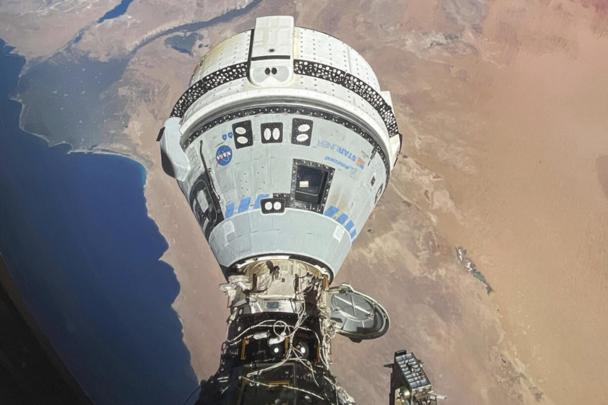 FILE - This photo provided by NASA shows the Starliner spacecraft docked to the Harmony module of the International Space Station, orbiting 262 miles above Egypt&rsquo;s Mediterranean coast, on June 13, 2024.