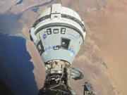 FILE - This photo provided by NASA shows the Starliner spacecraft docked to the Harmony module of the International Space Station, orbiting 262 miles above Egypt&rsquo;s Mediterranean coast, on June 13, 2024.