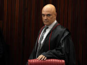 FILE - Brazilian Supreme Court Chief Justice Alexandre de Moraes arrives for a court hearing, in Brasilia, Brazil, June 22, 2023.