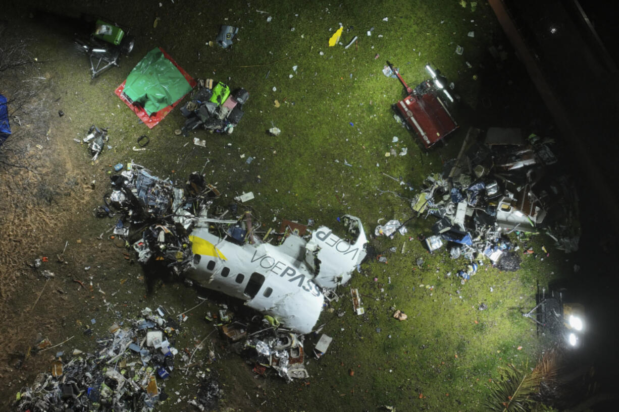 The debris at the site where an airplane crashed with 62 people on board, in Vinhedo, Sao Paulo state, Brazil, early on Saturday, Aug. 10, 2024. Brazilian authorities are working to piece together what exactly caused the plane crash in Sao Paulo state the previous day, killing all 62 people aboard.