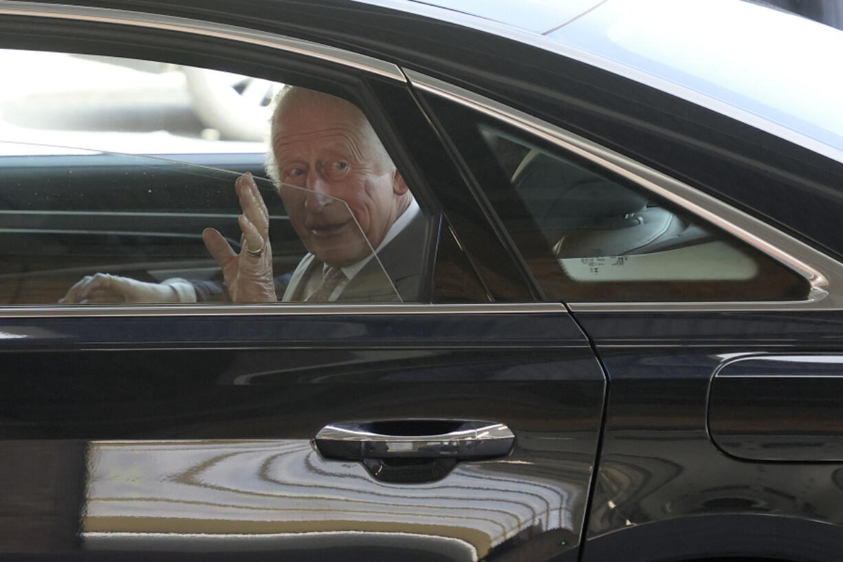 Britain&rsquo;s King Charles III waves as he leaves after meeting representatives from Merseyside&rsquo;s emergency services and local community groups at the Community Fire Station in Southport, England, Tuesday, Aug.