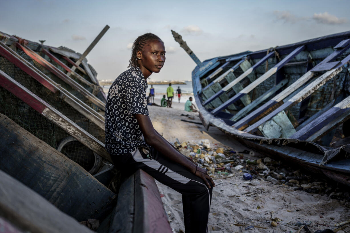 CORRECTS FAMILY NAME TO NDIAYE - Salamba Ndiaye, a 28-year-old who tried to migrate to Europe twice, poses for a photo at the beach in Thiaroye-Sur-Mer, Senegal, Friday, Aug. 23, 2024. Ndiaye is one of thousands of young Senegalese who try to flee poverty and the lack of job opportunities in the West African country each year to head to Spain. More than 22,300 people have landed on the Canary Islands from January to mid-August this year.