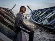 CORRECTS FAMILY NAME TO NDIAYE - Salamba Ndiaye, a 28-year-old who tried to migrate to Europe twice, poses for a photo at the beach in Thiaroye-Sur-Mer, Senegal, Friday, Aug. 23, 2024. Ndiaye is one of thousands of young Senegalese who try to flee poverty and the lack of job opportunities in the West African country each year to head to Spain. More than 22,300 people have landed on the Canary Islands from January to mid-August this year.