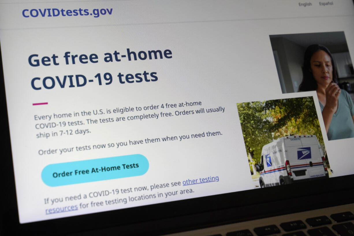 FILE - A United States government website, COVIDTests.gov, is displayed on a computer, Jan. 19, 2022, in Walpole, Mass.