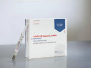 This photo provided by Moderna in August 2024 shows packaging and a syringe for the company&rsquo;s updated COVID vaccine for ages 12 and older approved by the U.S. Food and Drug Administration on Thursday, Aug. 22, 2024.