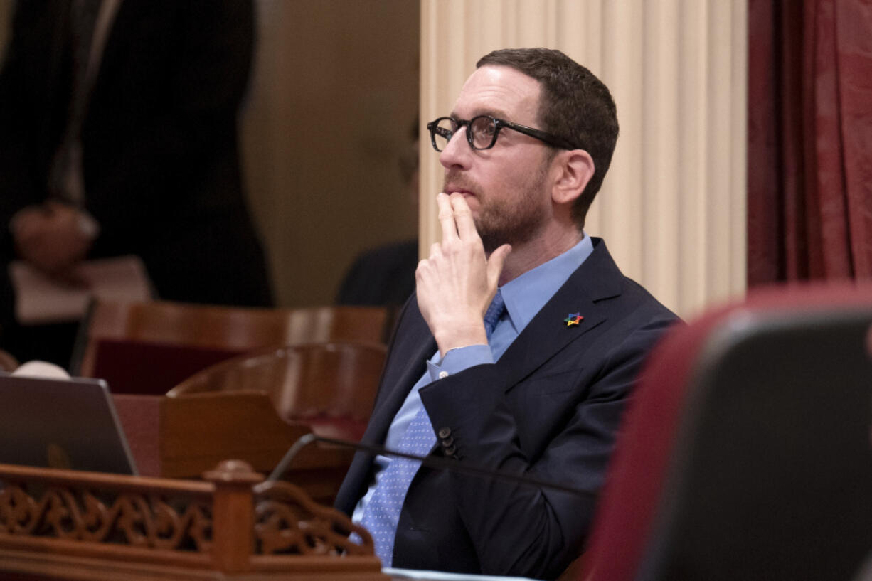 FILE - State Sen. Scott Wiener, D-San Francisco, watches as the Senate votes on a measure at the Capitol in Sacramento, Calif., Thursday, April 11, 2024.