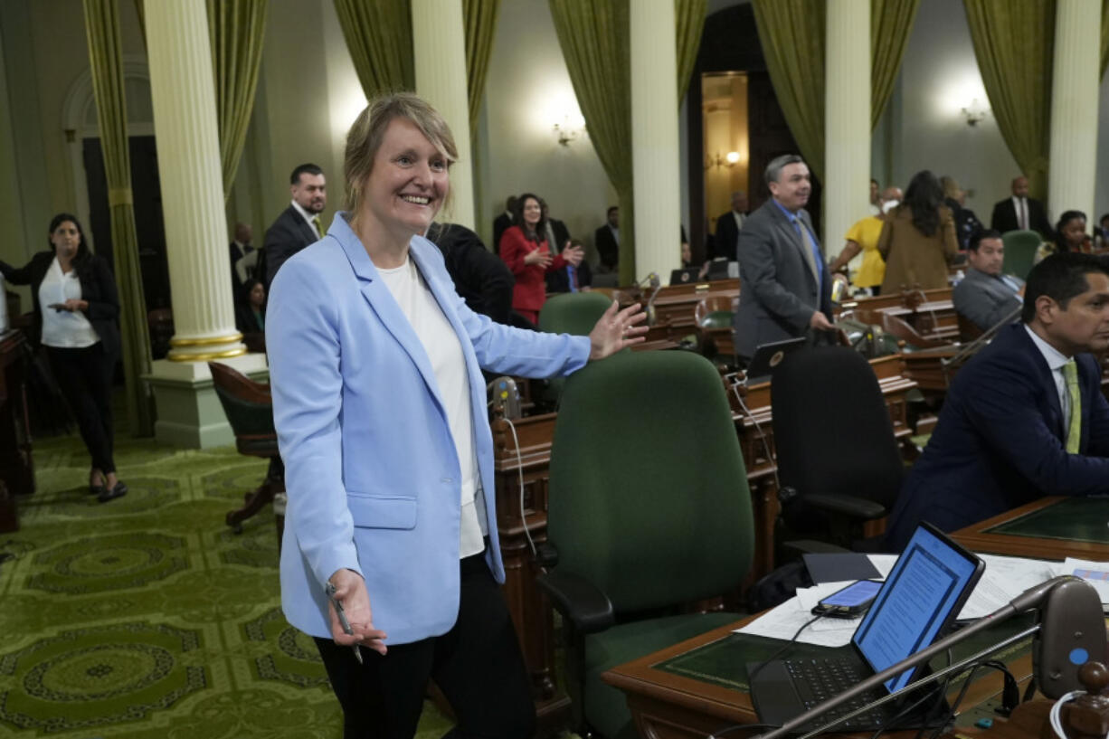 FILE - Assemblywoman Buffy Wicks, D-Oakland, smiles after measure that would force Big Tech companies to pay media outlets for using their news content was approved by the Assembly at the Capitol in Sacramento, Calif., Thursday, June 1, 2023.