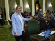 FILE - Assemblywoman Buffy Wicks, D-Oakland, smiles after measure that would force Big Tech companies to pay media outlets for using their news content was approved by the Assembly at the Capitol in Sacramento, Calif., Thursday, June 1, 2023.