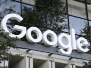 FILE - A Google sign hangs over an entrance to the company&rsquo;s new building, Sept. 6, 2023, in New York.