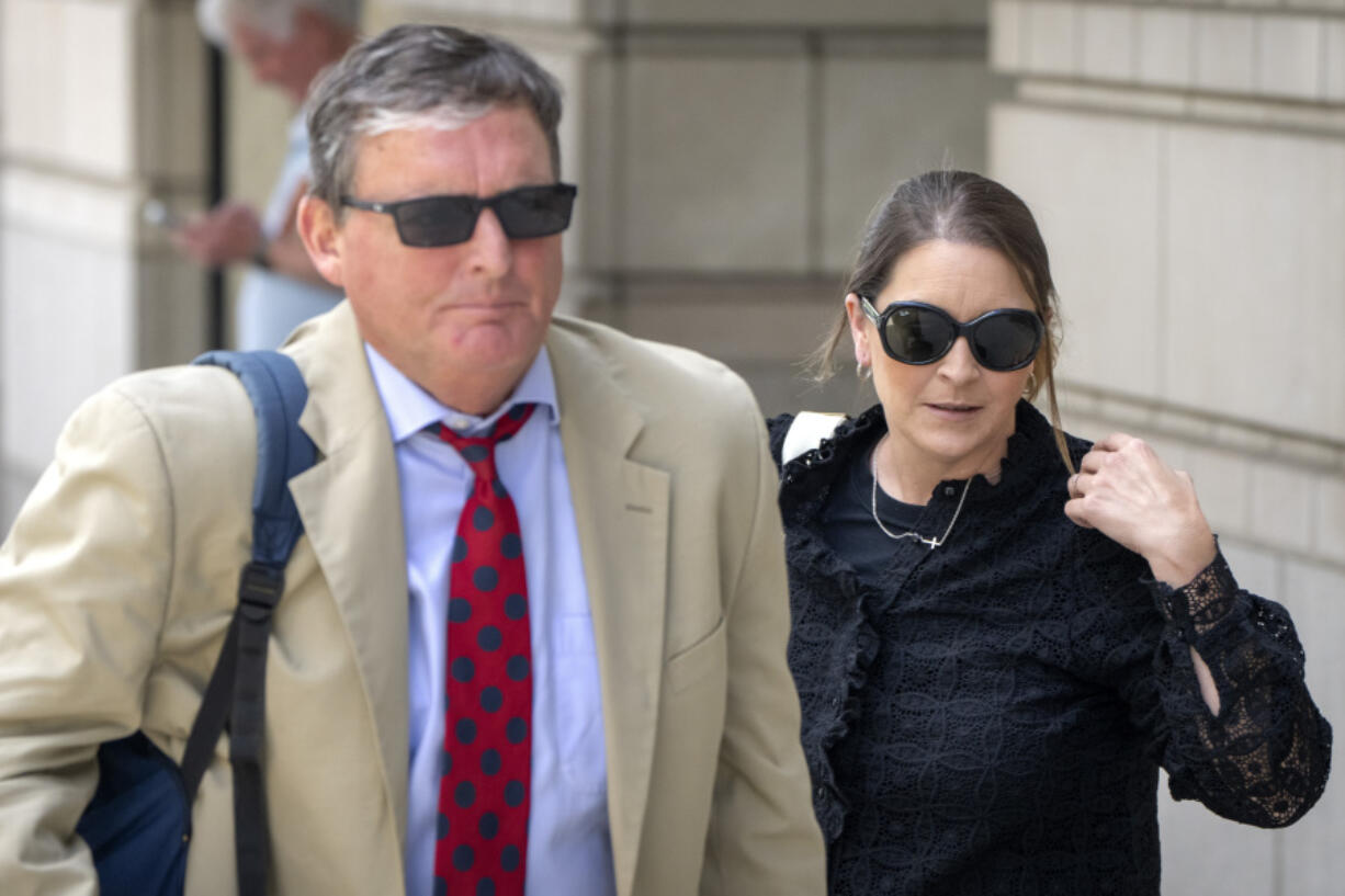 Kellye SoRelle, former general counsel for the Oath Keepers, right, and her attorney Horatio Aldredge leave federal court in Washington, Wednesday, Aug. 21, 2024.