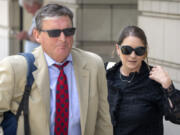 Kellye SoRelle, former general counsel for the Oath Keepers, right, and her attorney Horatio Aldredge leave federal court in Washington, Wednesday, Aug. 21, 2024.