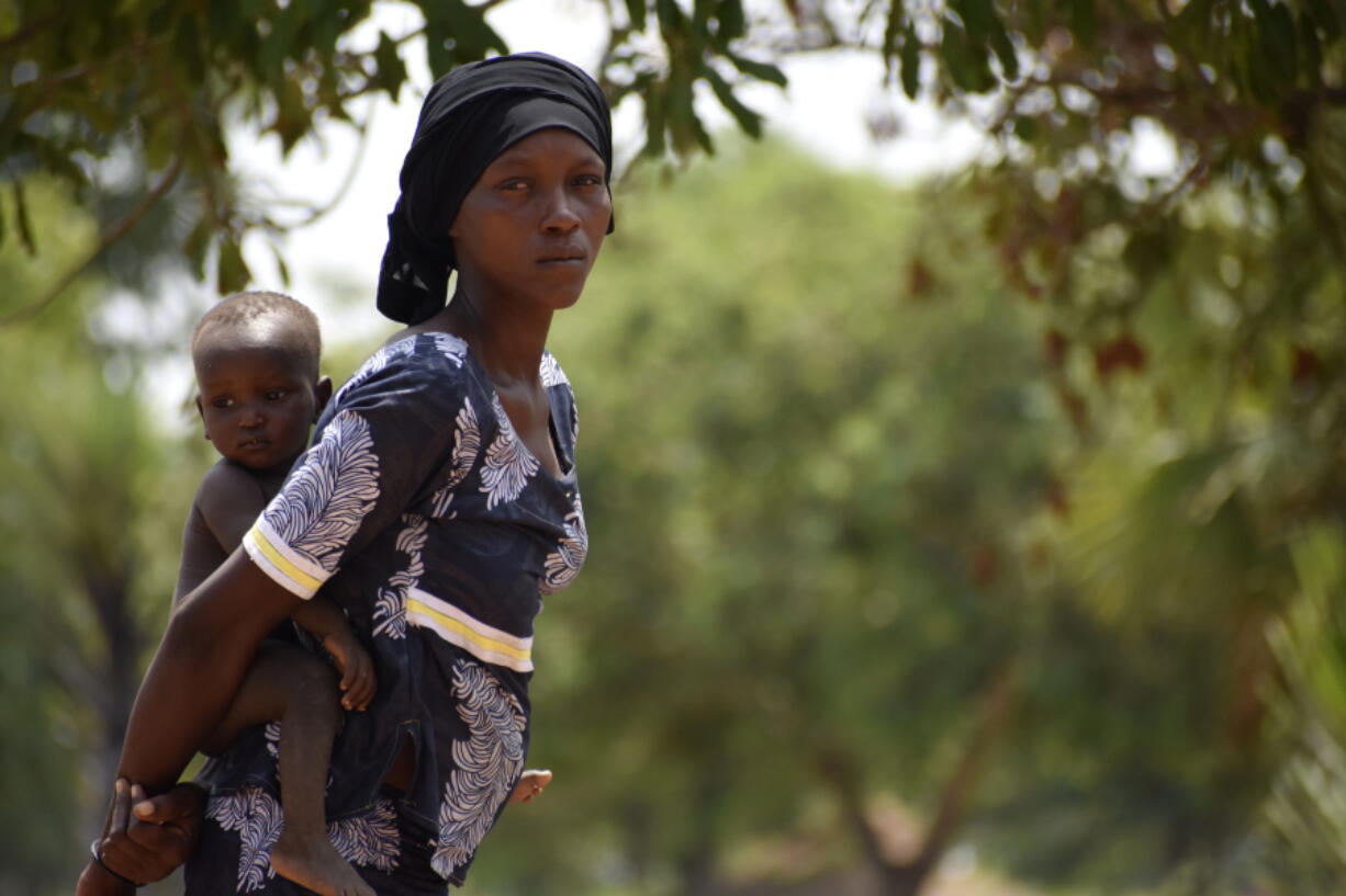 28-year-old Milla Nemoudji, a woman who was divorced by her husband following years of physical abuse, is photographed in a village of Binmar, Chad, Friday, July 19, 2024.