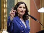 FILE - Michigan Gov. Gretchen Whitmer delivers her State of the State address, Jan. 24, 2024, at the state Capitol in Lansing, Mich. It was billed the &ldquo;biggest ever economic development project&rdquo; in north Michigan when Gov. Gretchen Whitmer in 2022 welcomed a Chinese battery company to build a $2.36-billion factory and bring a couple thousands of jobs to Big Rapids. But now the project by the Chinese lithium-ion battery maker Gotion High-Tech is in the crosshairs of some U.S.