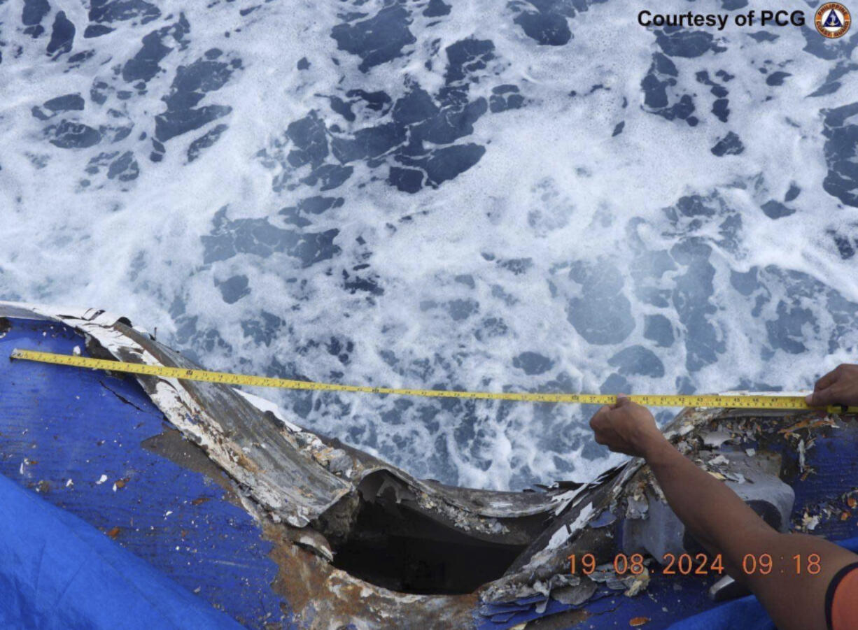 This photo provided by the Philippine Coast Guard, shows damage on the Philippines coast guard vessel BRP Cape Engano (MRRV-4411) after a collision with a Chinese coast guard ship Monday, Aug. 19, 2024 in the disputed South China Sea.