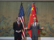 Wang Yi, right, the director of the Communist Party&rsquo;s Central Foreign Affairs Commission Office speaks before a talk with White House national security adviser Jake Sullivan, left, before their talk at Yanqi lake in Beijing, Tuesday, Aug. 27, 2024.