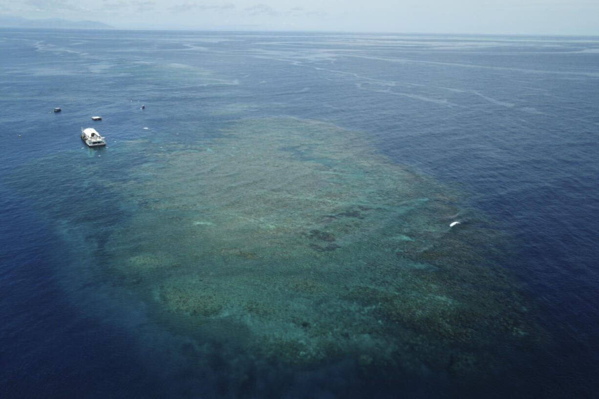 The Remoora pontoon, owned by Reef Magic, sits above a section of the Great Barrier Reef near Moore Reef in Gunggandji Sea Country off the coast of Queensland in eastern Australia on Nov. 14, 2022.