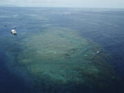 The Remoora pontoon, owned by Reef Magic, sits above a section of the Great Barrier Reef near Moore Reef in Gunggandji Sea Country off the coast of Queensland in eastern Australia on Nov. 14, 2022.