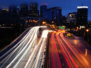 FILE - Vehicles move along Interstate 76 ahead of the Thanksgiving Day holiday in Philadelphia, Nov. 22, 2023.